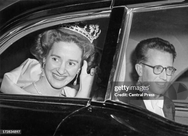 King Baudouin of Belgium and Queen Fabiola of Belgium wave to crowds after their wedding ceremony, Brussels, 15th December 1960.