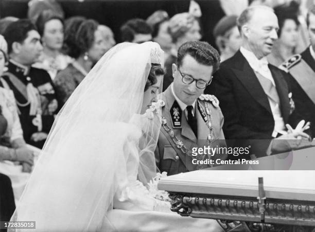 King Baudouin of Belgium and Queen Fabiola of Belgium during their civil wedding ceremony at the Royal Palace of Brussels, 15th December 1960....