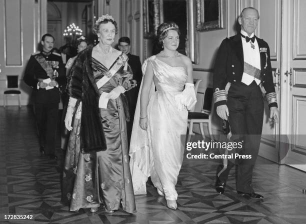 Princess Margaretha of Sweden and Prince Axel of Denmark accompany Princess Irene of the Netherlands at a banquet given by the Belgian government at...