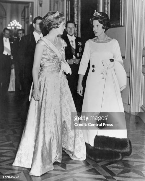 Queen Anne of Romania and Princess Lilian of Belgium followed by King Michael I of Romania and Simeon II of Bulgaria, attend a banquet given by the...