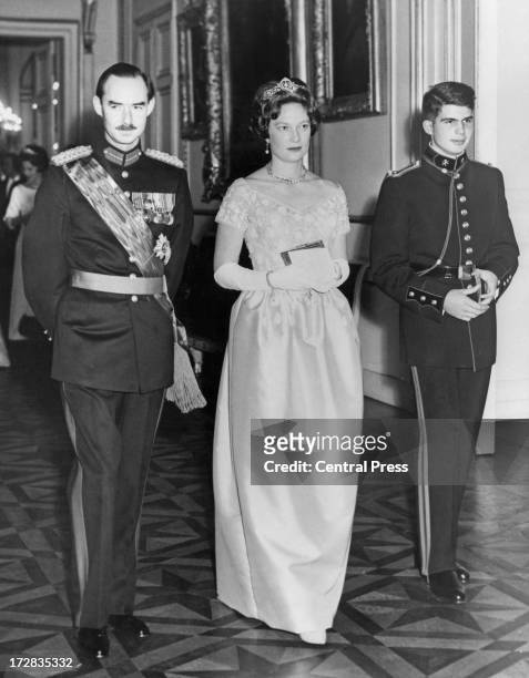 Jean, Grand Duke of Luxembourg with his wife Princess Josephine Charlotte of Belgium accompanied by Prince Alexander of Belgium attend a banquet...