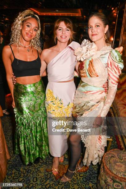 Pearl Mackie, Ophelia Lovibond and Charity Wakefield attend the Harper's Bazaar Art Party, supported by Jaguar, on October 10, 2023 in London,...