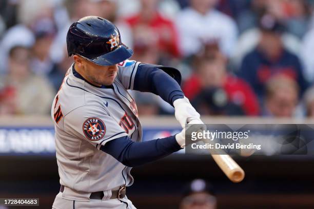 Alex Bregman of the Houston Astros hits a home run in the fifth inning against the Minnesota Twins during Game Three of the Division Series at Target...