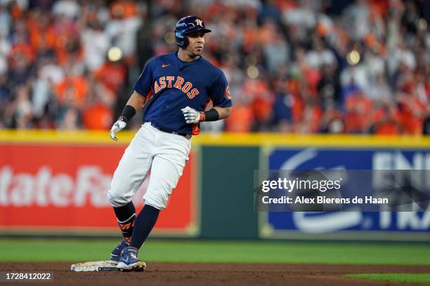 Michael Brantley of the Houston Astros pauses on second base after hitting a double in the sixth inning during Game 2 of the ALCS between the Texas...