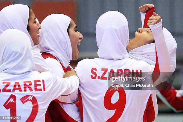 Gholami Nasimeh Sadat of Iran celebrates with team mates Zarei Fahimeh and Zarrinrad Sepideh after scoring a goal against Japan during the Women's...