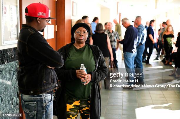 Sheneen McClain, Elijah McClains mother, second from left, stands in the hallway during a break in closing arguments at the Adams County Justice...