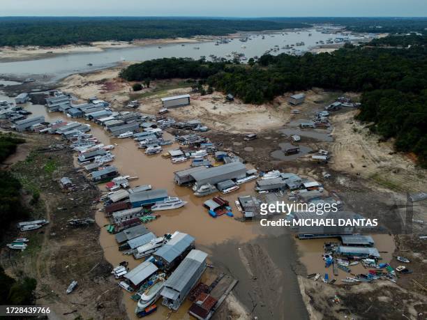 Floating houses and boats are seen stranded at the Marina do Davi, a docking area of the Negro river, city of Manaus, Amazonas State, northern...