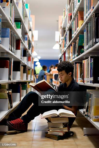 Stack On Homework Kids Sitting On Stack Of Books Photos and Premium High Res Pictures ...