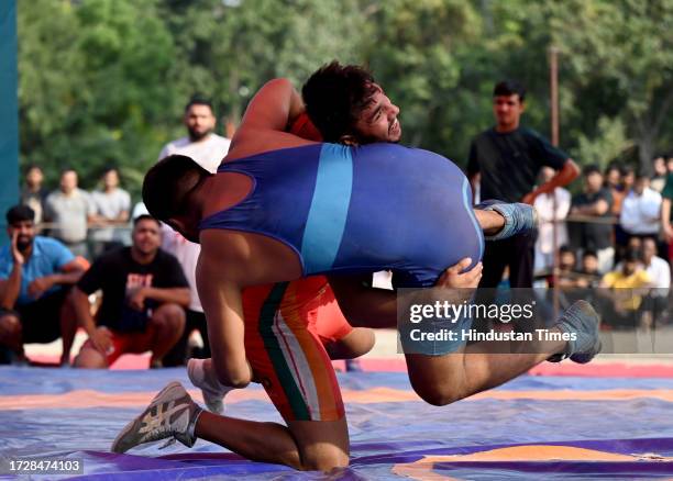 Wrestlers in action during the 29th Rishipal Awana Dangal Championship at Sector 15 on October 16, 2023 in Noida, India.