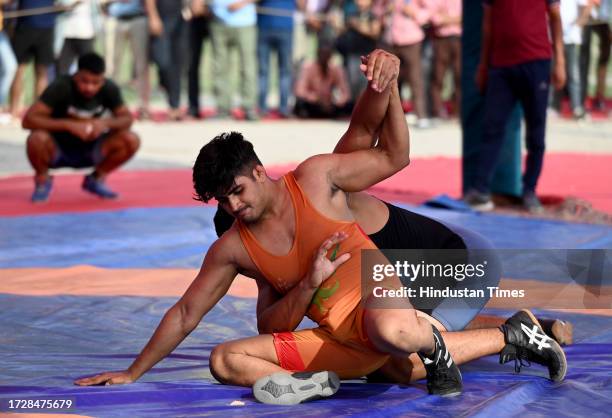 Wrestlers in action during the 29th Rishipal Awana Dangal Championship at Sector 15 on October 16, 2023 in Noida, India.