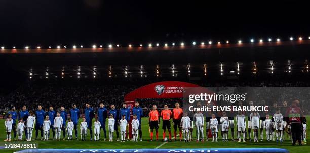 National teams of Bosnia and Herzegovina and of Portugal , pose before their UEFA's EURO 2024 qualification football match, in Zenica on October 16,...