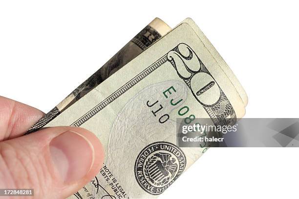 tipping twenty - twenty us dollar note stock pictures, royalty-free photos & images