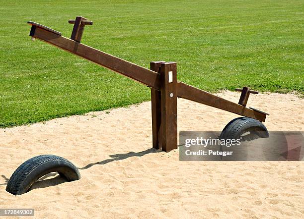 children's playground - seesaw stock pictures, royalty-free photos & images