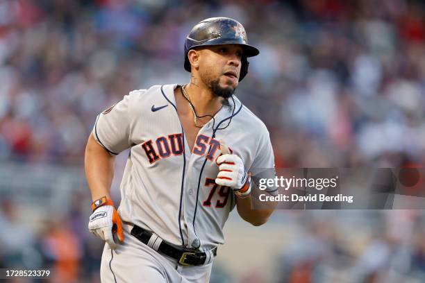 José Abreu of the Houston Astros rounds the bases after hitting a home run in the ninth inning against the Minnesota Twins during Game Three of the...
