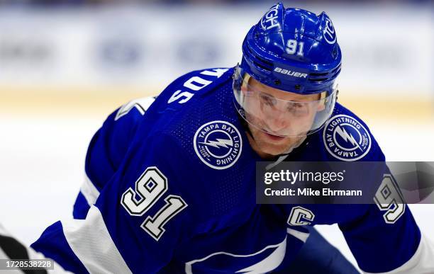 Steven Stamkos of the Tampa Bay Lightning faces off during the opening night game against the Nashville Predators at Amalie Arena on October 10, 2023...