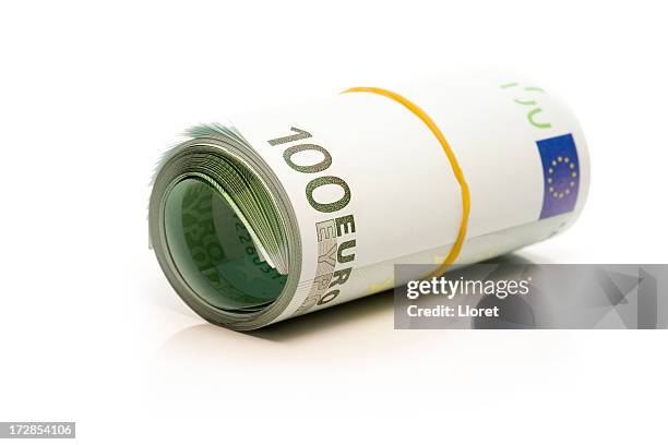 euro banknotes money roll - money roll stock pictures, royalty-free photos & images