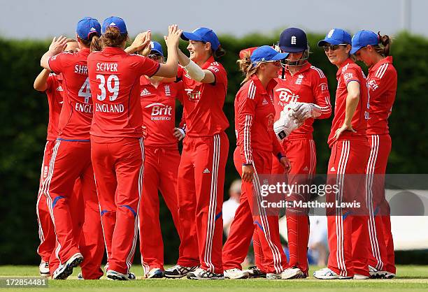 Arran Brindle of England is congratulated on catching Syeda Nain Fatima Abidi of Pakistan during the 2nd NatWest Women's International T20 match...