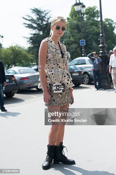 Software Designer Inga Kozel wears Chanel bag and boots, Moscat sunglasses, Alexander Mcqueen couture top, Josef Statkus skirt on day 2 of Paris...