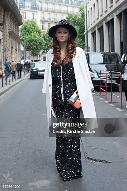 Fashion Director Nina Vasadze wears Fendi bag and shoes, Margiela hat, Wildfox jumpsuit, jil Sander jacket on day 2 of Paris Collections: Womens...