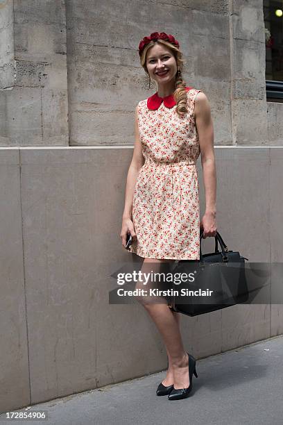 Make up artist Renata Khafizova wears her own design dress and head piece, Michael Kors bag and Andrea shoes on day 2 of Paris Collections: Womens...