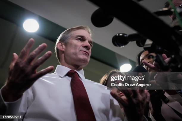 Rep. Jim Jordan speaks briefly to reporters as he departs a House Republican Caucus at the U.S. Capitol October 16, 2023 in Washington, DC. House...