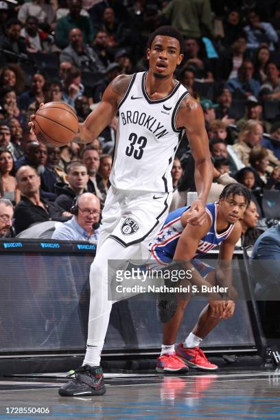 Nicolas Claxton of the Brooklyn Nets dribbles the ball against the Philadelphia 76ers on October 16, 2023 at Barclays Center in Brooklyn, New York....