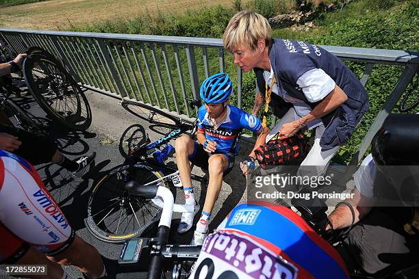 Christian Vande Velde of the United States and Garmin-Sharp is attended to following a crash during stage seven of the 2013 Tour de France, a 205.5KM...