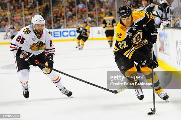 Shawn Thornton of the Boston Bruins skates with the puck against Viktor Stalberg of the Chicago Blackhawks in Game Six of the Stanley Cup Final at TD...