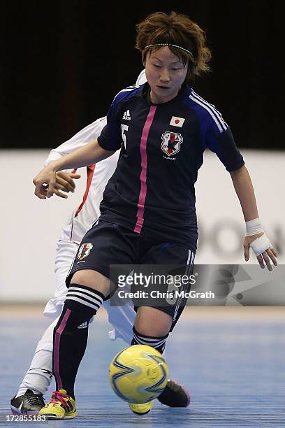 Natsumi Koide of Japan makes a break against Iran during the Women's Futsal Gold Medal match between Iran and Japan at Songdo Global University...