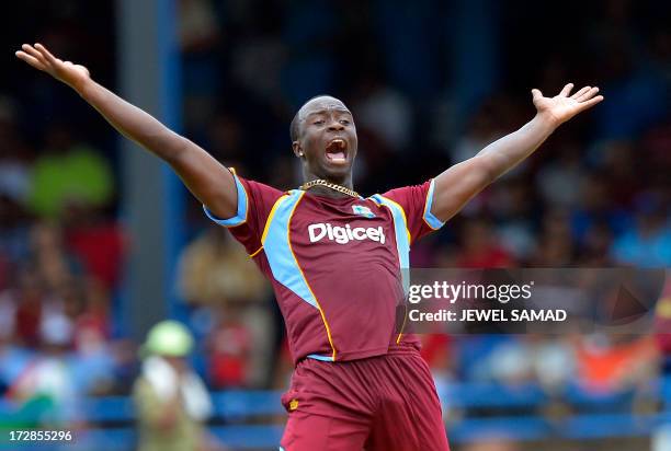 West Indies cricketer Kemar Roach unsuccessfully appeals for a dismissal against Indian cricket team captain Virat Kohli during the fourth match of...