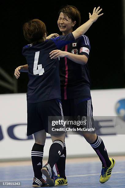 Kana Shibahara of Japan celebrates victory with team mate Shiori Nakajima during the Women's Futsal Gold Medal match between Iran and Japan at Songdo...