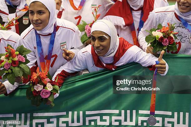 Tavasoli Sis Farzaneh of Iran celebrates with her silver medal during the victory ceremony for the Women's Futsal Gold Medal match between Iran and...