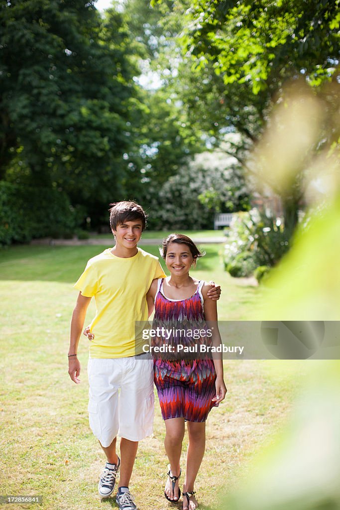 Smiling teenage couple outdoors