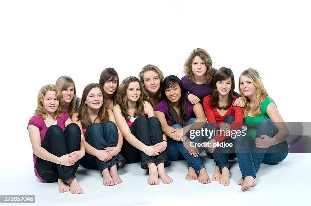 ten smiling teenage girls on the floor - girl barefoot stock pictures, royalty-free photos & images
