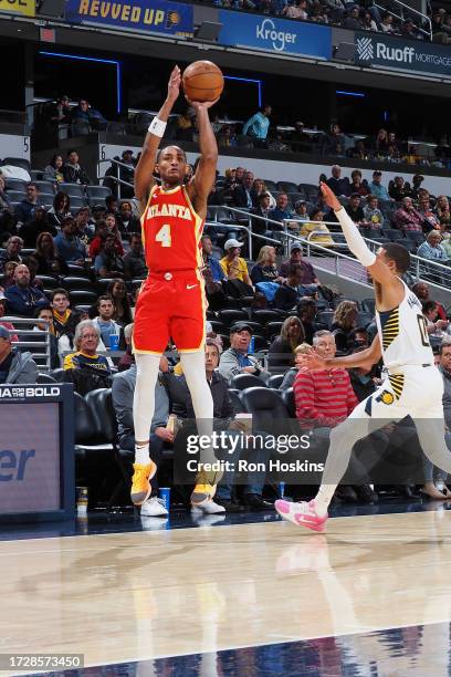 Kobe Bufkin of the Atlanta Hawks shoots a three point basket against the Indiana Pacers on October 16, 2023 at Gainbridge Fieldhouse in Indianapolis,...