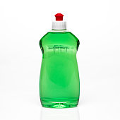 A bottle of green dishwashing detergent