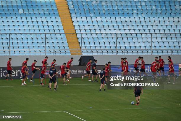 Chile's football team players take part in a training session at the Monumental stadium in Maturin, Monagas State, Venezuela, on October 16 on the...