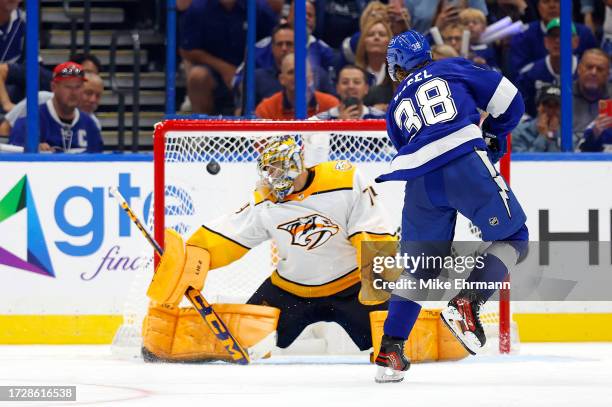 Brandon Hagel of the Tampa Bay Lightning scores a goal third period during the opening night game against the Nashville Predators at Amalie Arena on...