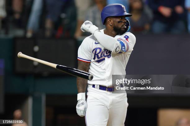 Adolis Garcia of the Texas Rangers celebrates after hitting a three-run home run against the Baltimore Orioles during the second inning in Game Three...