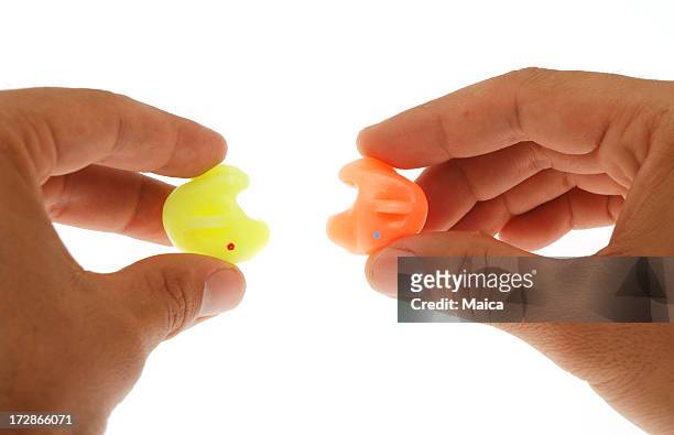 ear plugs - ear plug ear protectors stock pictures, royalty-free photos & images