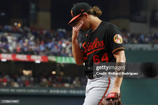 Dean Kremer of the Baltimore Orioles reacts after being removed from the game against the Texas Rangers during the second inning in Game Three of the...