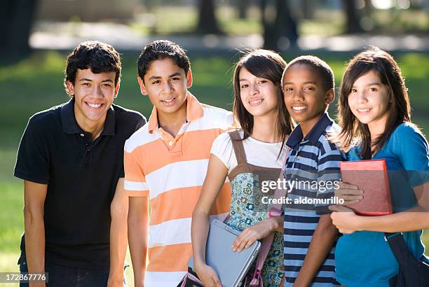 teen friends preparing to study, facing camera - alleen tieners stockfoto's en -beelden