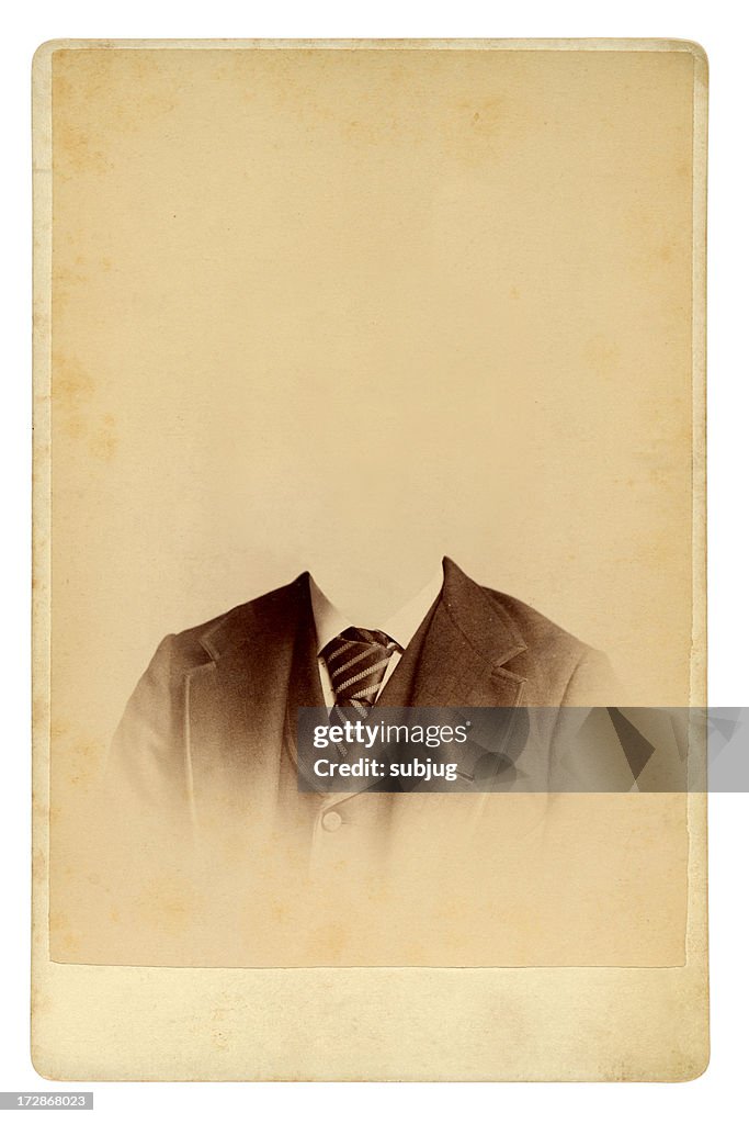 Antique photo of man in gradually fading suit with no head