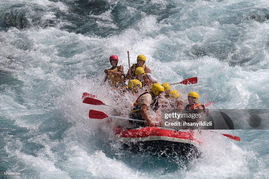 Red raft in violent white water