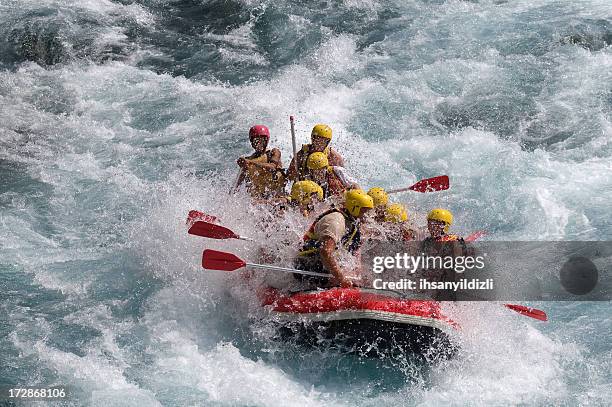 red raft in violent white water - extreme sports team stock pictures, royalty-free photos & images