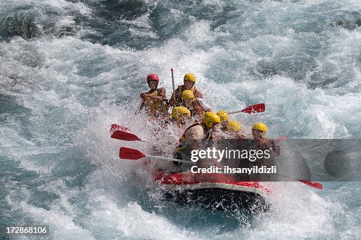 Red raft in violent white water Red raft in violent white water