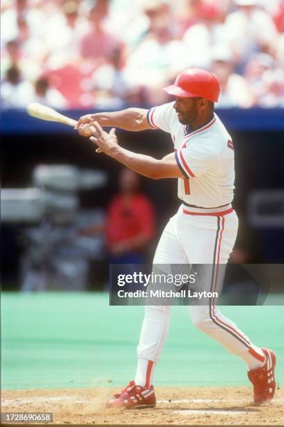 Ozzie Smith of the St. Louis Cardinals takes a swing during a baseball game against the New York Mets on June 29, 1991 at Busch Stadium in St. Louis,...