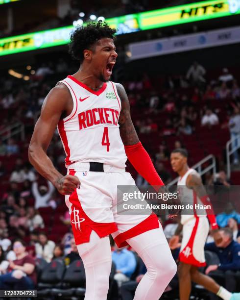 Jalen Green of the Houston Rockets reacts after a dunk in the third quarter of the preseason game against the Indiana Pacers at Toyota Center on...