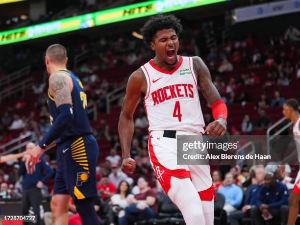 Jalen Green of the Houston Rockets reacts after a dunk in the third quarter of the preseason game against the Indiana Pacers at Toyota Center on...