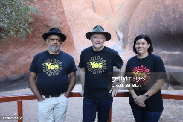 Noel Pearson, Australian Prime Minister Anthony Albanese and Hon Natasha Fyles pose for a photo beneath Uluru on October 11, 2023 in Uluru,...